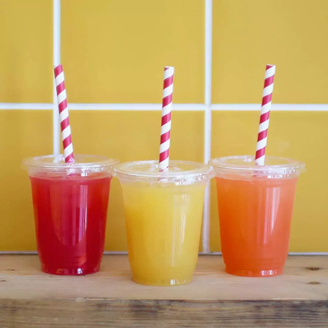 Three homemade Squeezed lemonades with striped straws